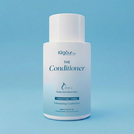 Kilgour MD The Conditioner bottle on a blue background