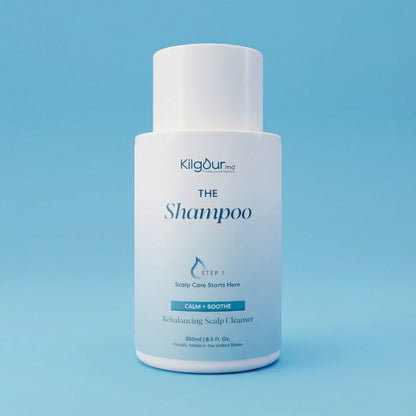 Kilgour shampoo bottle on a blue background